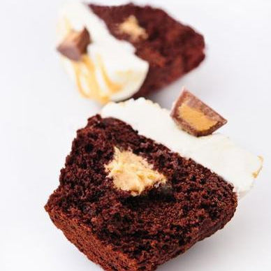 open faced peanut butter chocolate cupcake with peanut butter center / cupcakes near me