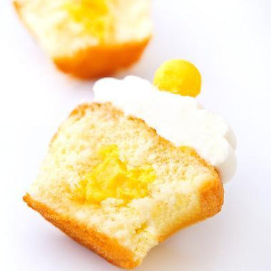 open faced passionfruit cupcake with passion fruit center / cupcakes near me