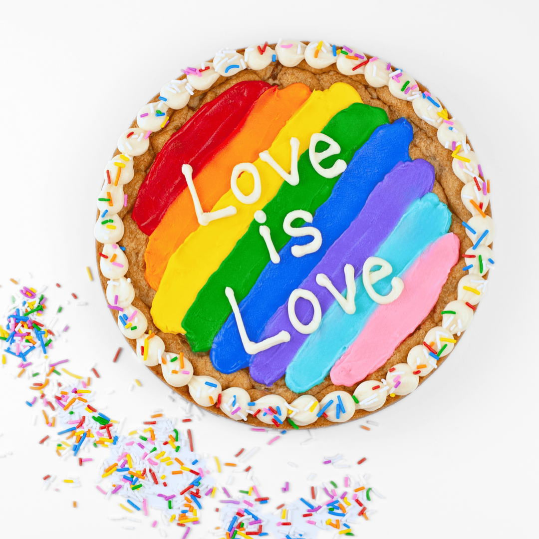 Rainbow-colored pie with 'Love is Love' text and sprinkles on a white background