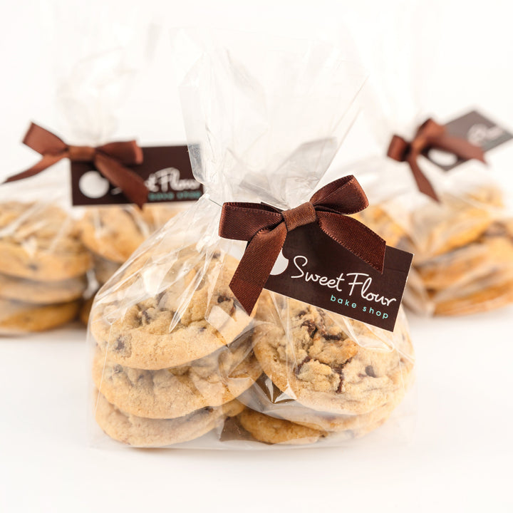 Packaged mini chocolate chip cookies with tag on a white background