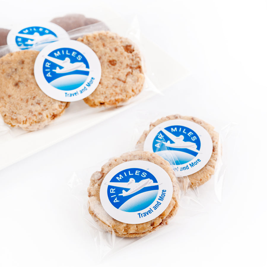 Cookies with Air Miles stickers on a white background
