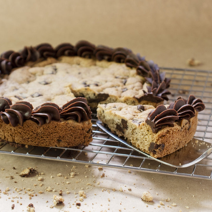 8 inch round Chocolate Chunk Cookie Cake with blue and brown icing