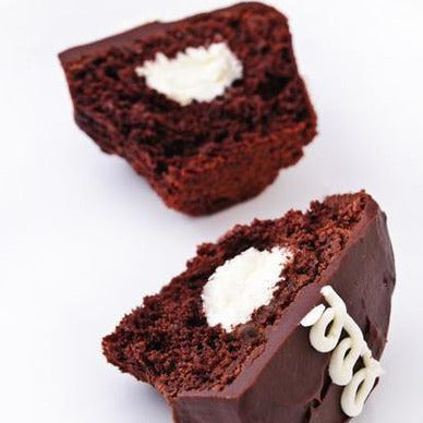 open faced chocolate cupcake with vanilla filling