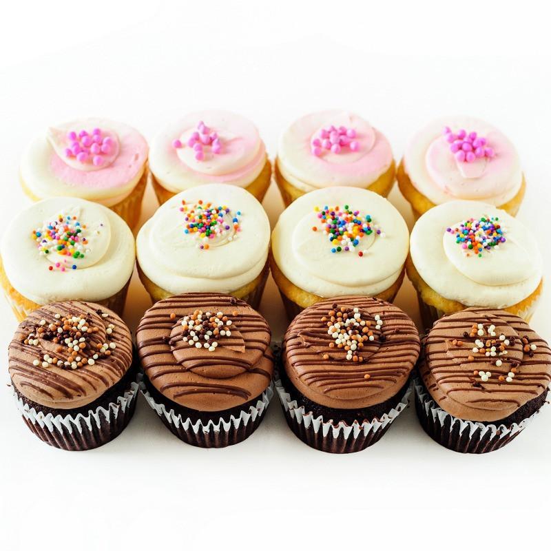 One dozen neapolitan cupcakes with chocolate, vanilla and strawberry icing