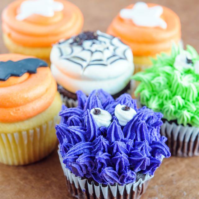 close up of monster and spiderweb Halloween cupcakes / cupcakes near me