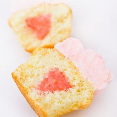 open faced pink lemonade cupcake with lemon raspberry filling